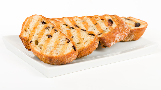 Toasted Kalamata Bread - Crusty black olive bread sliced and grilled.