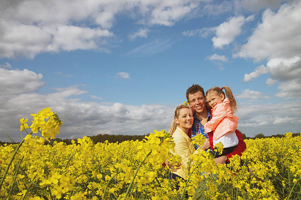 istock happy family outdoor in rape field 488760727