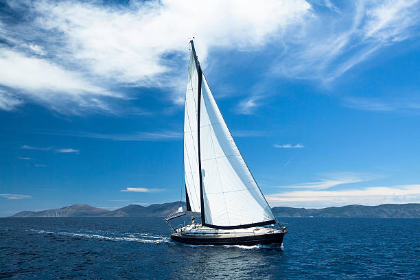 istock Sailing ship yachts with white sails in the Sea. 488762198