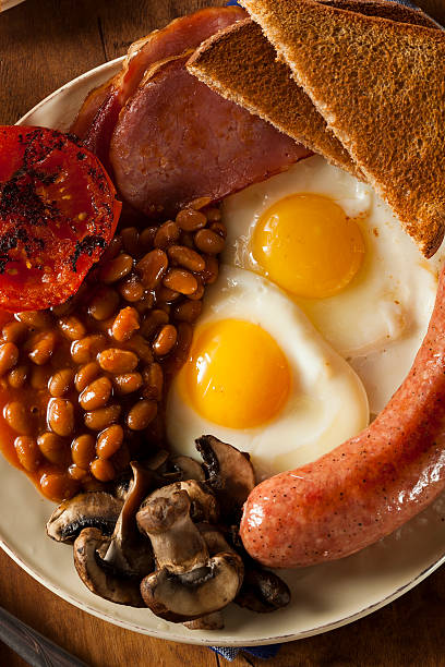 istock Traditional Full English Breakfast with Eggs, Bacon, and Baked Beans 488762297