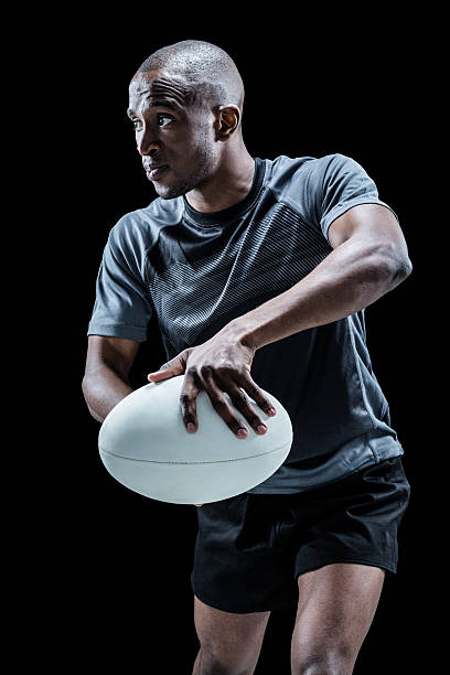 istock Determined rugby player in position to throw ball 488762358
