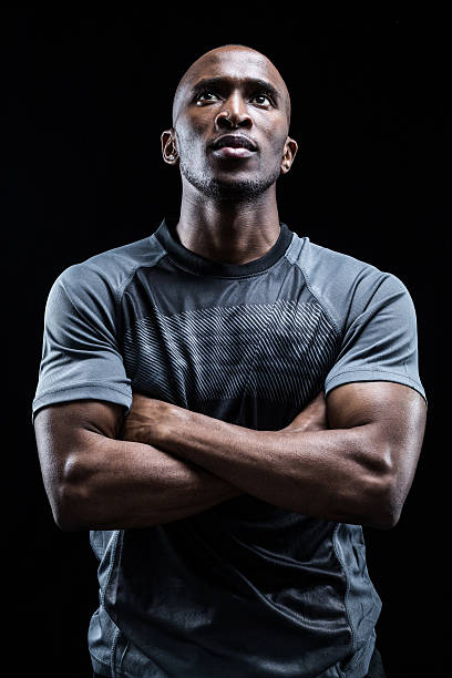 istock Thoughtful rugby player with arms crossed 488762540