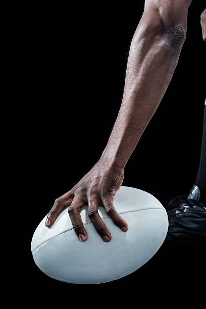 istock Cropped image of athlete holding rugby ball 488764242