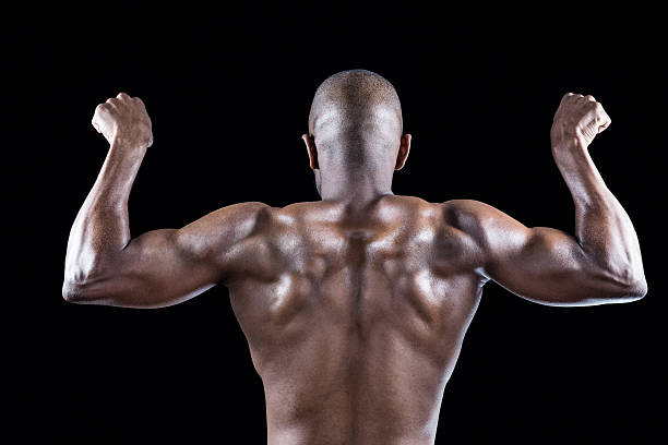 istock Rear view of muscular athlete posing 488766872