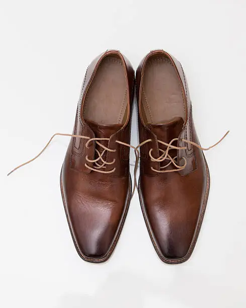 Photo of Mens brown leather shoes isolated