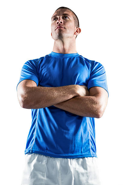 istock Serious rugby player looking away with arms crossed 488769472