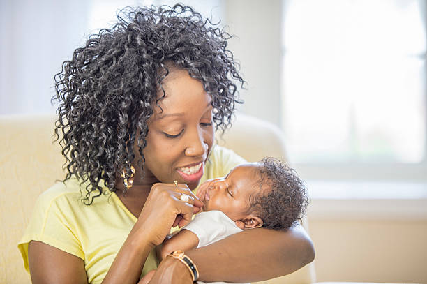 istock Admiring Her Newborn Baby 488769944