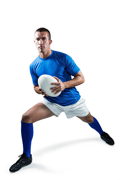 istock Full length of rugby player exercising with ball 488770412