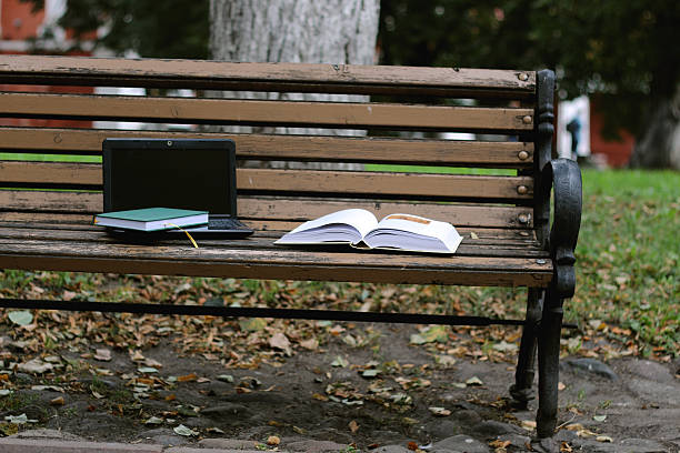 istock books on a bench in the school year 488770778