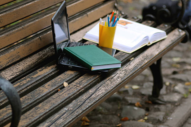 istock books on a bench in the school year 488770800