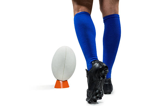 istock Low section of rugby player about to kick the ball 488770812