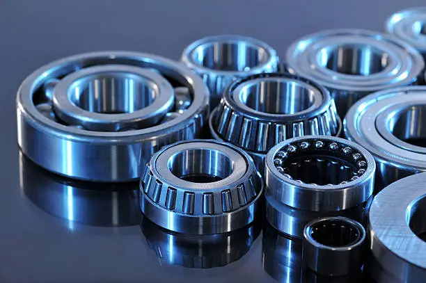 closeup view of several ball-bearings in blue light