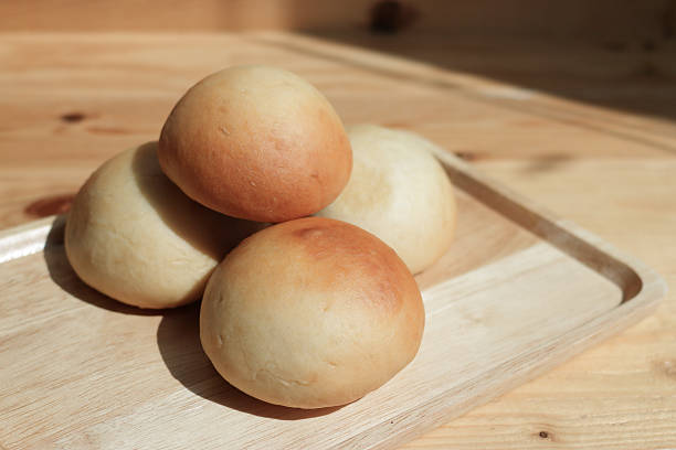 istock Buns on wooden plate 488784188