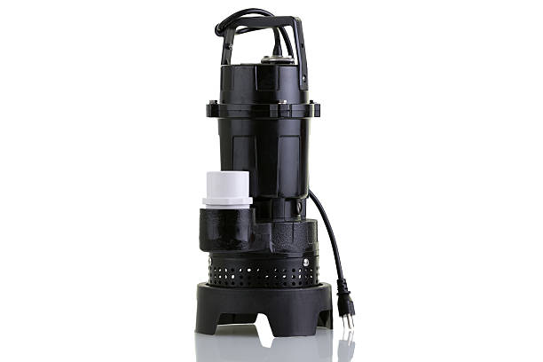 New sump pump Brand new sump pump for suctioning collected ground water from a sump pit such as in a basement of a house water pump photos stock pictures, royalty-free photos & images