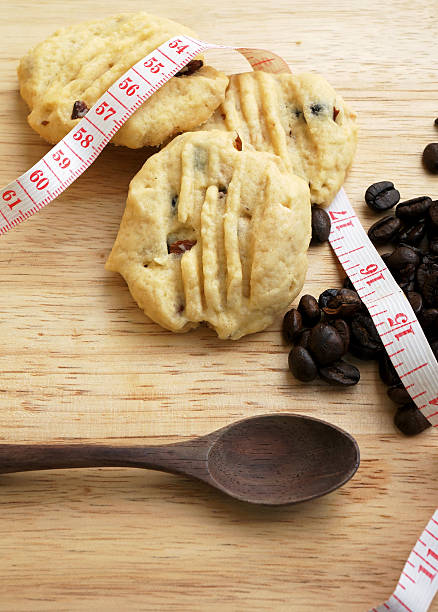 istock Low fat cookies on wooden table with coffee bean 488784527