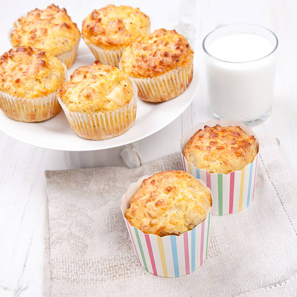 istock Savory cheese and bacon muffins on the white table 488784931