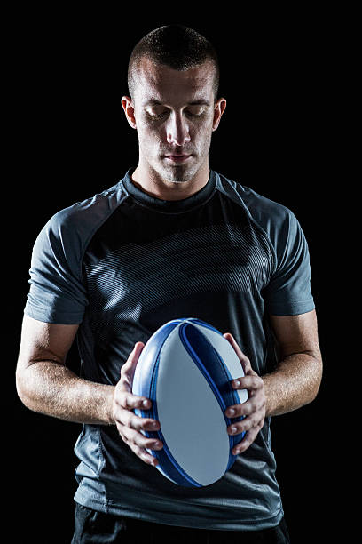istock Thoughtful rugby player holding ball 488785518