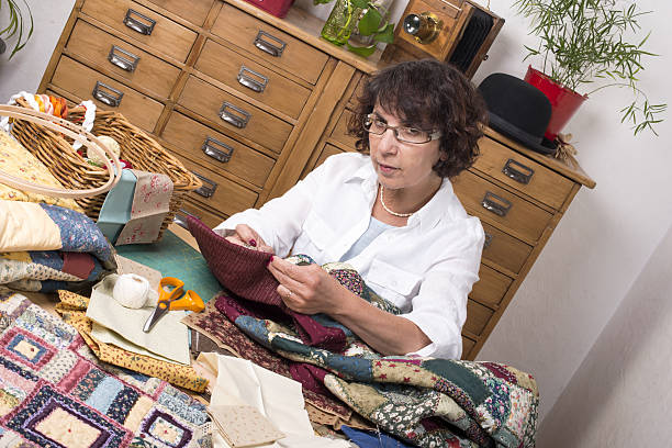 istock Mature woman by sewing and quilting 488786045
