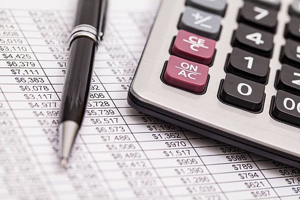 istock Balancing the Accounts. Calculator, pen 488786827