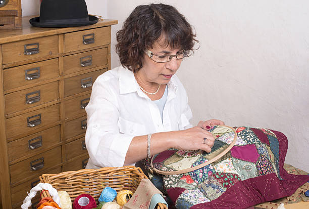 istock Mature woman by sewing and quilting 488787931