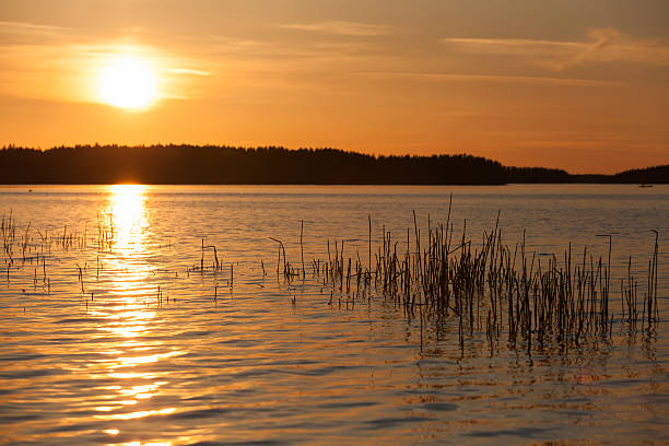 istock Orange sunset on Saimaa lake in Finland 488788345