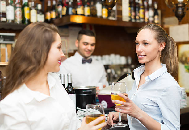 istock Two girls flirting with barman 488790202