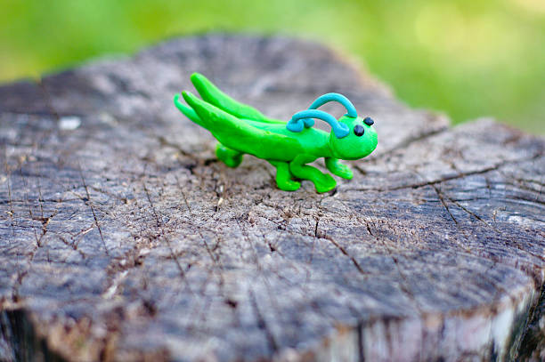 istock Grasshopper made of plasticine on natural background 488792884