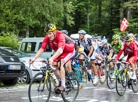 Le Markstein, France- July 13, 2014: The French cyclist Adrien Petit of Team Cofidis in front of a group of riders, climbing the road to mountain pass Le Markstein in Vosges mountains during the stage 9 of Le Tour de France 2014.
