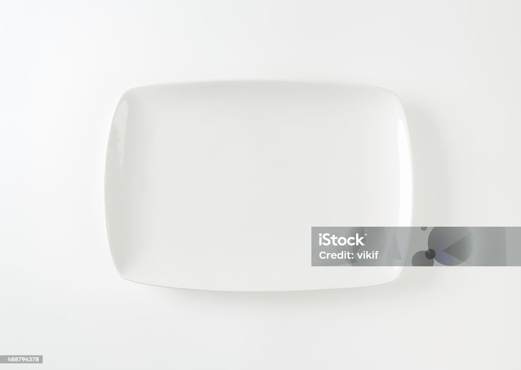 Rectangle white porcelain plate Rectangle all-white porcelain plate with rounded corners Plate Stock Photo