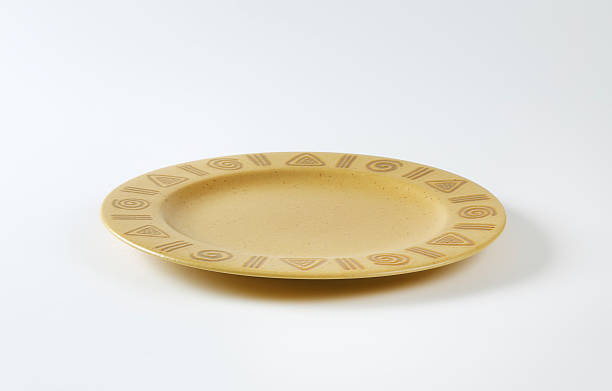 istock Handmade pottery plate with decorated rim 488794628