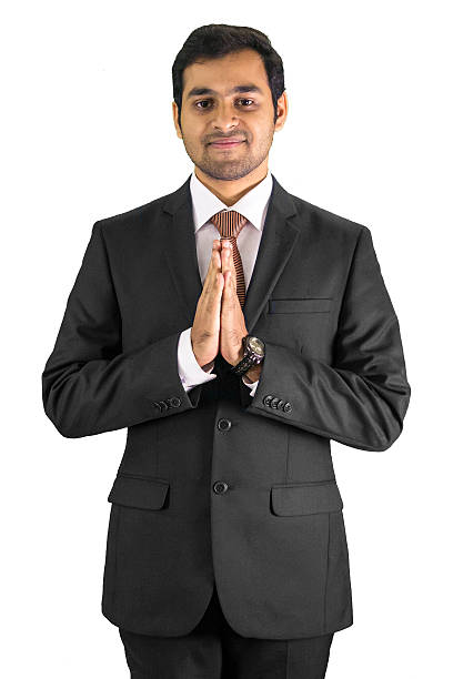 istock Young business man greeting with Namaste gesture 488794814