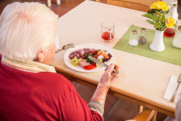 istock Elderly woman in a nursing home 488795438
