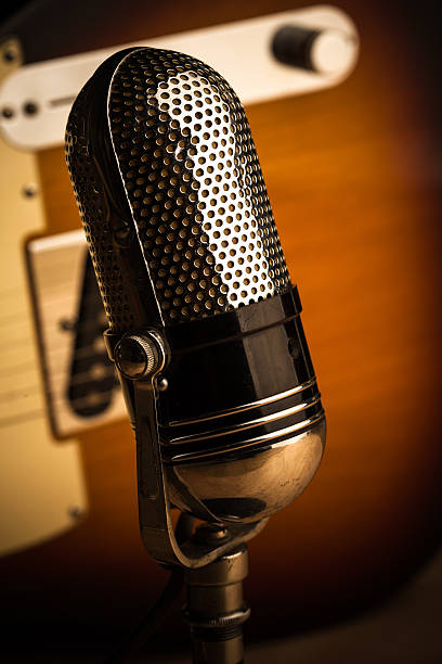 istock Vintage Mic with Guitar in Background 488795526