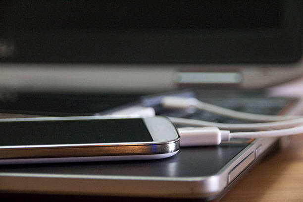istock Smartphones connected to a laptop computer 488797204