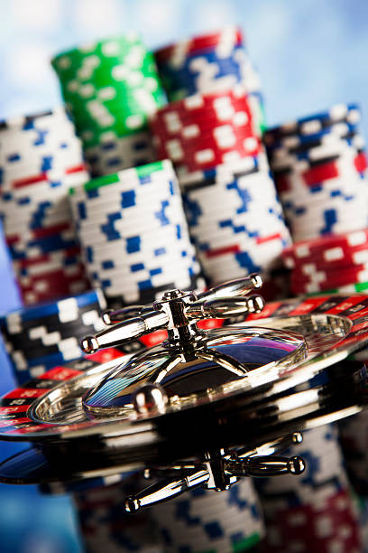 istock Poker Chips on a gaming with casino roulette 488797232