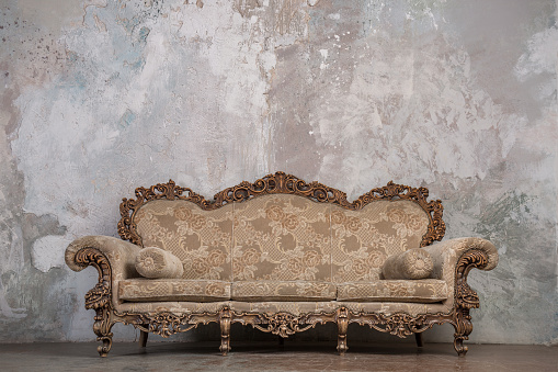 Antique Sofa Against Old Stucco Background Stock Photo - Download Image Now  - Sofa, Old-fashioned, Antique - iStock
