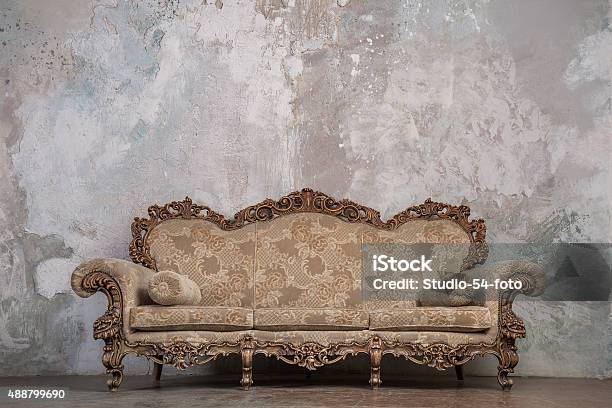 Antique Sofa Against Old Stucco Background Stock Photo - Download Image Now - Sofa, Antique, Old