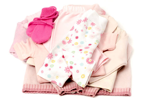 istock Close up with a pink stack of clean baby clothes 488802041