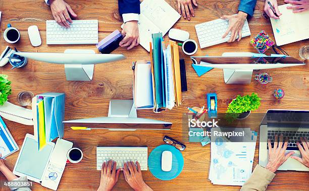 Group Of Business People Working On An Office Desk Stock Photo - Download Image Now - Administrator, Professional Occupation, Expertise