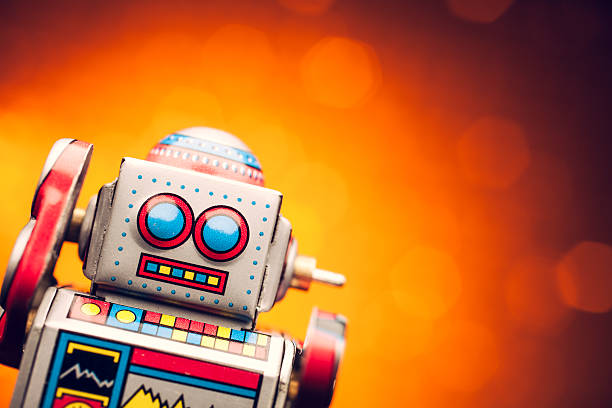 istock Retro tin robot portrait on orange 488803923