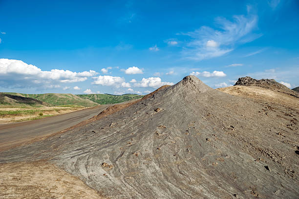 istock Mud volcanoes with spectaculos clouds from Mud Volcanoes 488805425