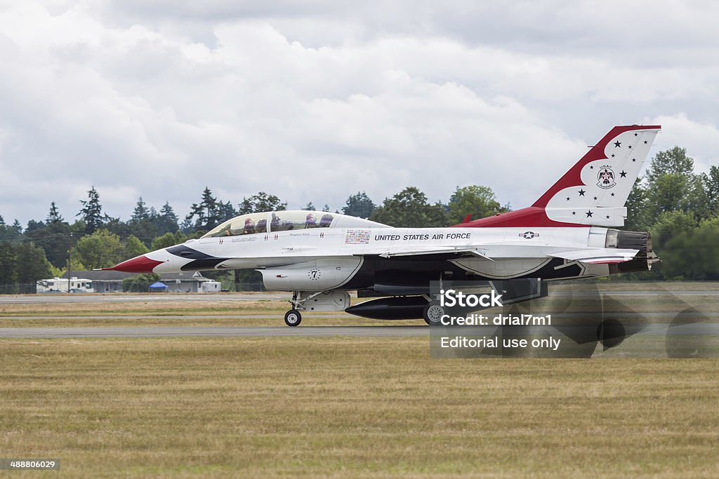 Thunderbird On The Runway Lakewood, United States- July 21, 2012:  Joint Base Lewis-McChord opens its gates to the public for a free airshow.  This image shows one of the USAF Thunderbirds team on the runway. Aerospace Industry Stock Photo