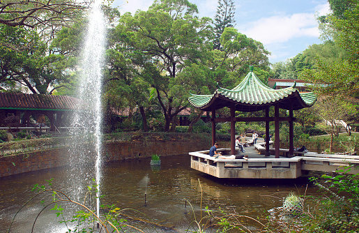 Hong Kong, Hong Kong S.A.R. - March 20, 2014: People relax in the Kowloon park Hong Kong at the Tsim Sha Tsui district, Hong Kong.