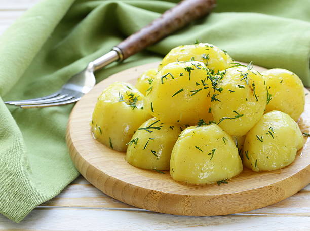 istock boiled fresh organic potatoes with the oil and dill 488806721