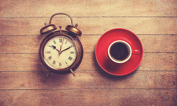 istock Alarm clock and cup of a coffee 488807113
