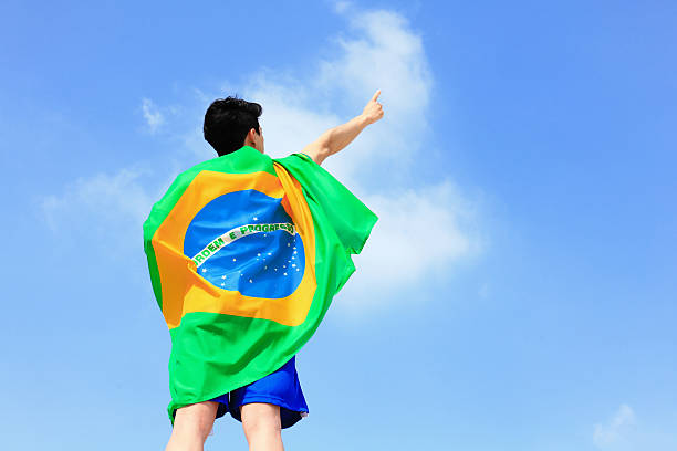 istock Excited man holding a brazil flag 488807429