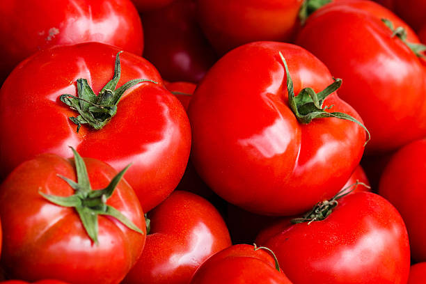 istock Group of fresh tomatoes background. Ripe red 488807571