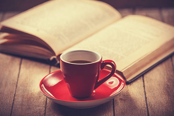 istock red cup of the coffee and vintage book. 488807661