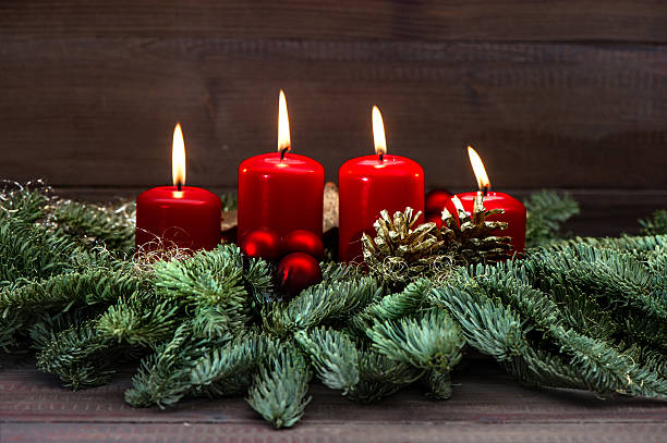 istock advent decoration with four red burning candles 488808701