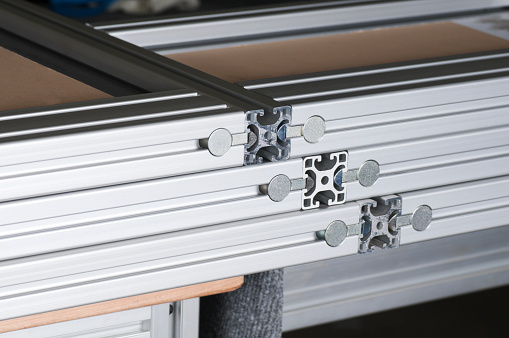 Aluminum framing assembly components at a mechanical fabrication manufacturing plant.